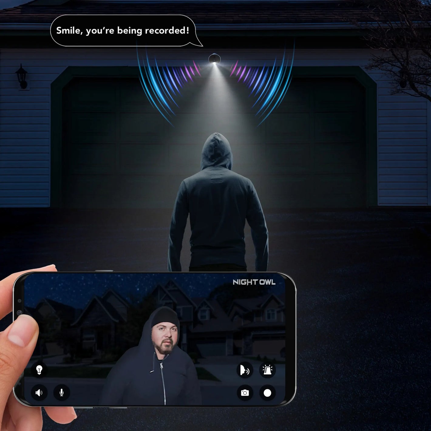 Security system with spotlight on recording a stranger in a hood outside the house